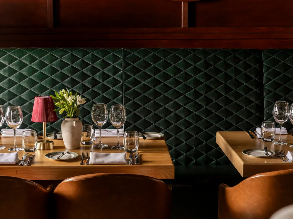 A table set by the green booth at Smith's Bar & Grill, Paddington