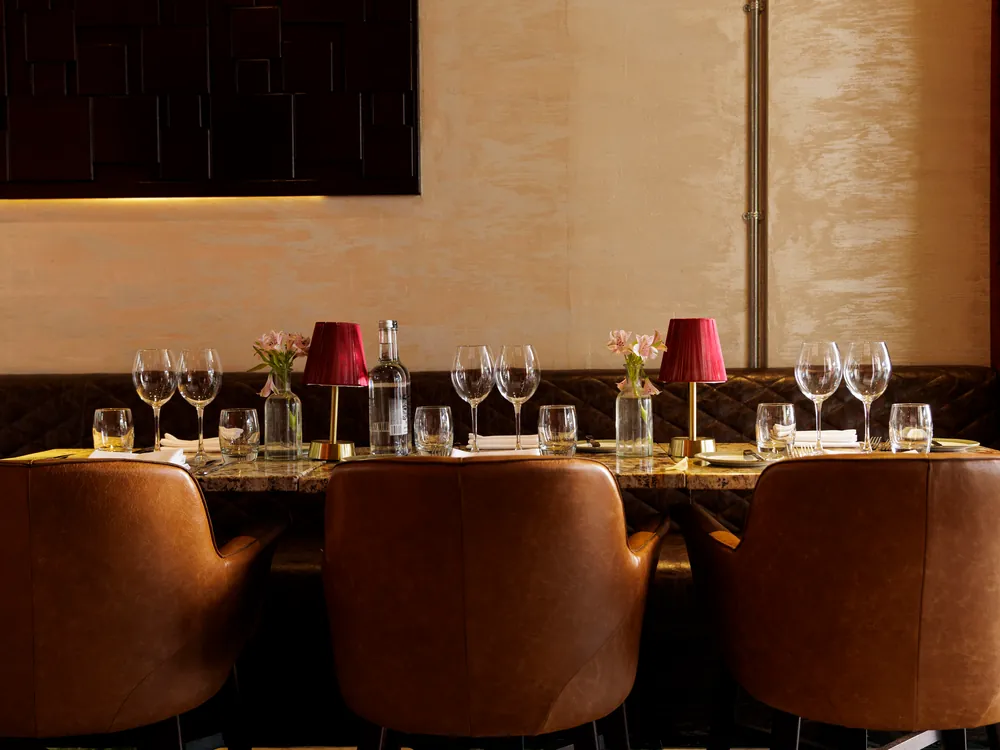 A group table set with red lamps at Smith's Bar & Grill