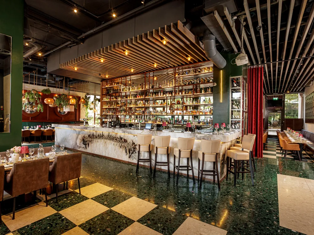 The marble bar and dining tables at Smith's Bar & Grill