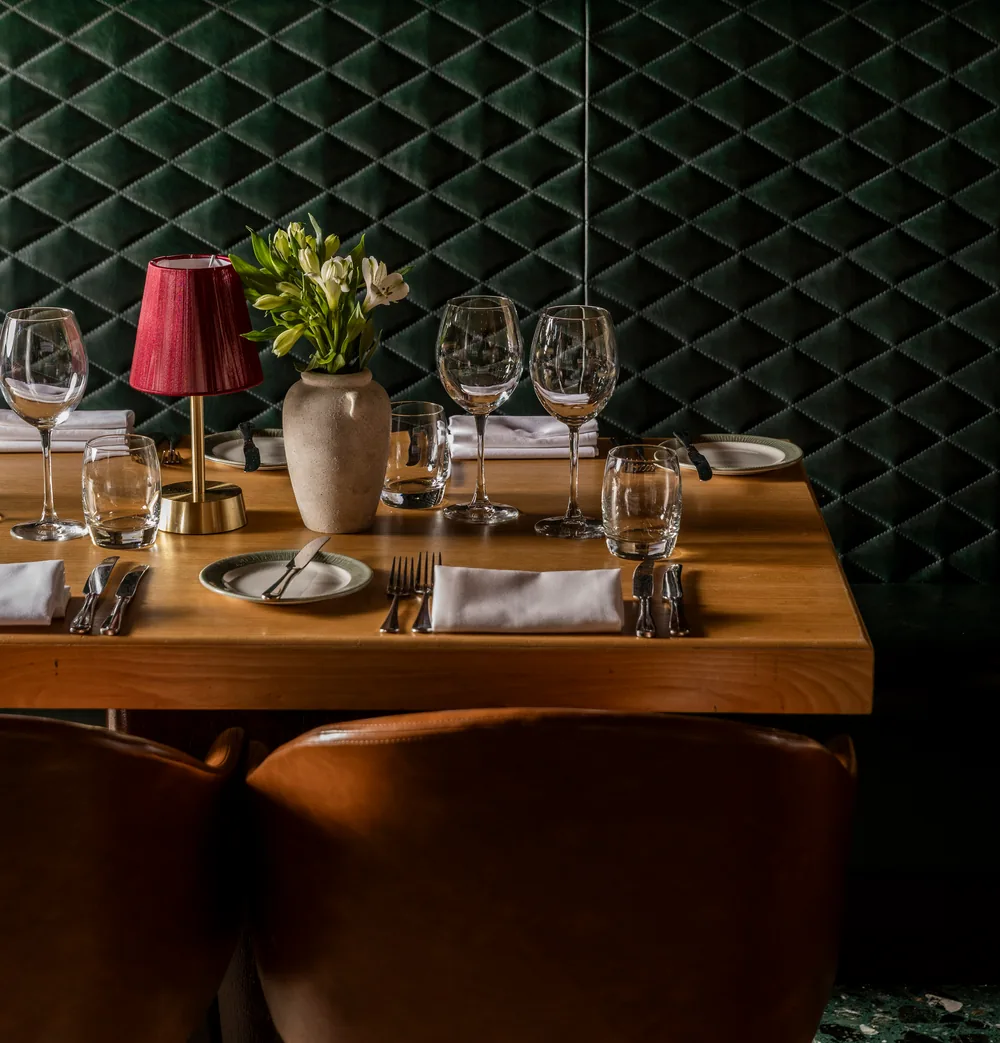A green leather booth at Smith's Bar & Grill